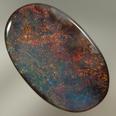 SOLID BLACK OPAL Burning red over a blue background